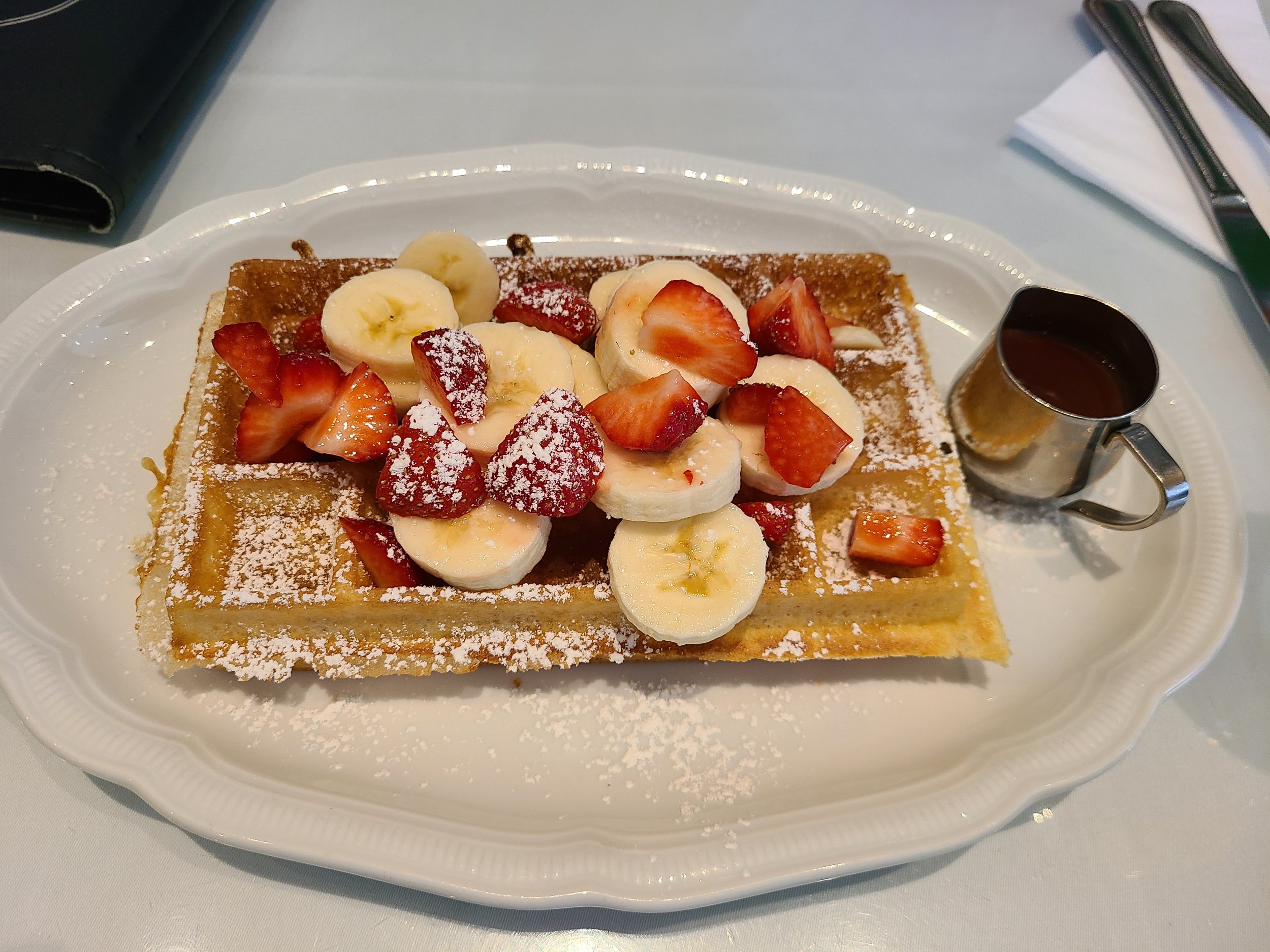  Belgian waffles with bananas, strawberries and chocolate. 