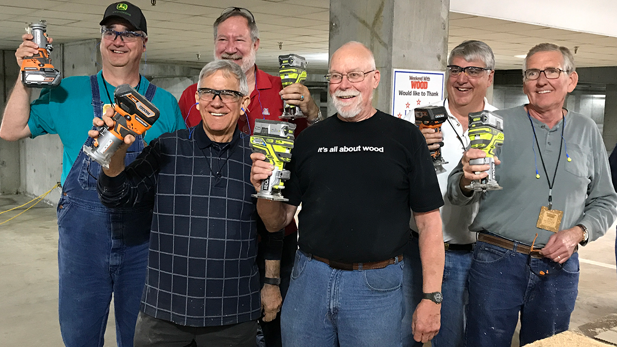 2017 Weekend With WOOD attendees pose with cordless tools following the completion of the Charity Build, supported by Ridgid and Ryobi.
