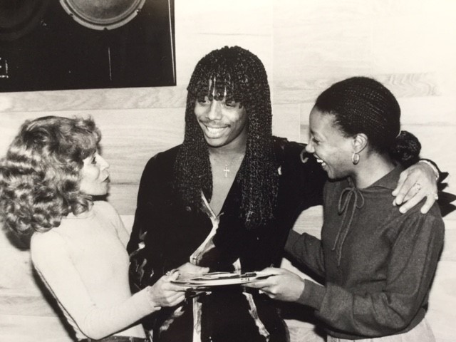 In 1982, Rick James hands over the tape of the Temptations' "Standing On The Top," which he wrote and produced, to Motown's Raynoma Singleton (left) and Brenda Boyce.