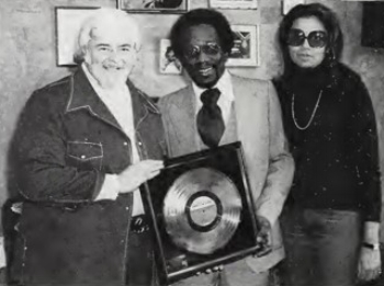 James Anthony Carmichael with Motown execs Barney Ales, Suzanne DePasse