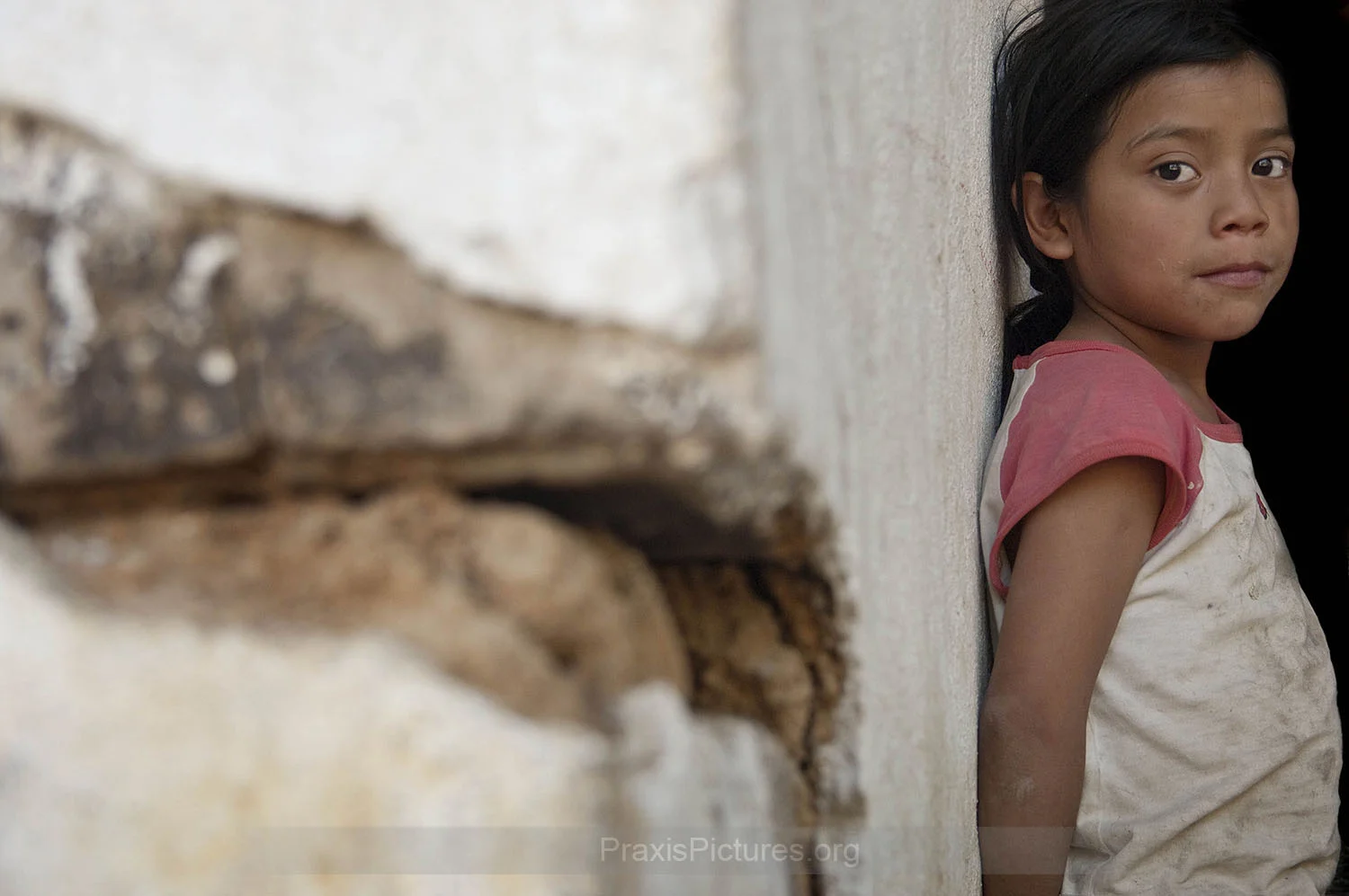YOLANDA - In San Miguel Ixtahuacan, Guatemala, Yolanda lives in one of the houses surrounding the Marlin Mine. Over a hundred of these houses have suffered structural damage, including cracking walls and floors, since the mining activities began. The company denies any responsibility, but villagers are convinced that the cracks are being caused by the daily dynamite explosions in the mine. “Our houses are falling apart!” says Yolanda’s neighbor Irma, “I’m scared to be inside my house, because one day it can fall on top of us!”