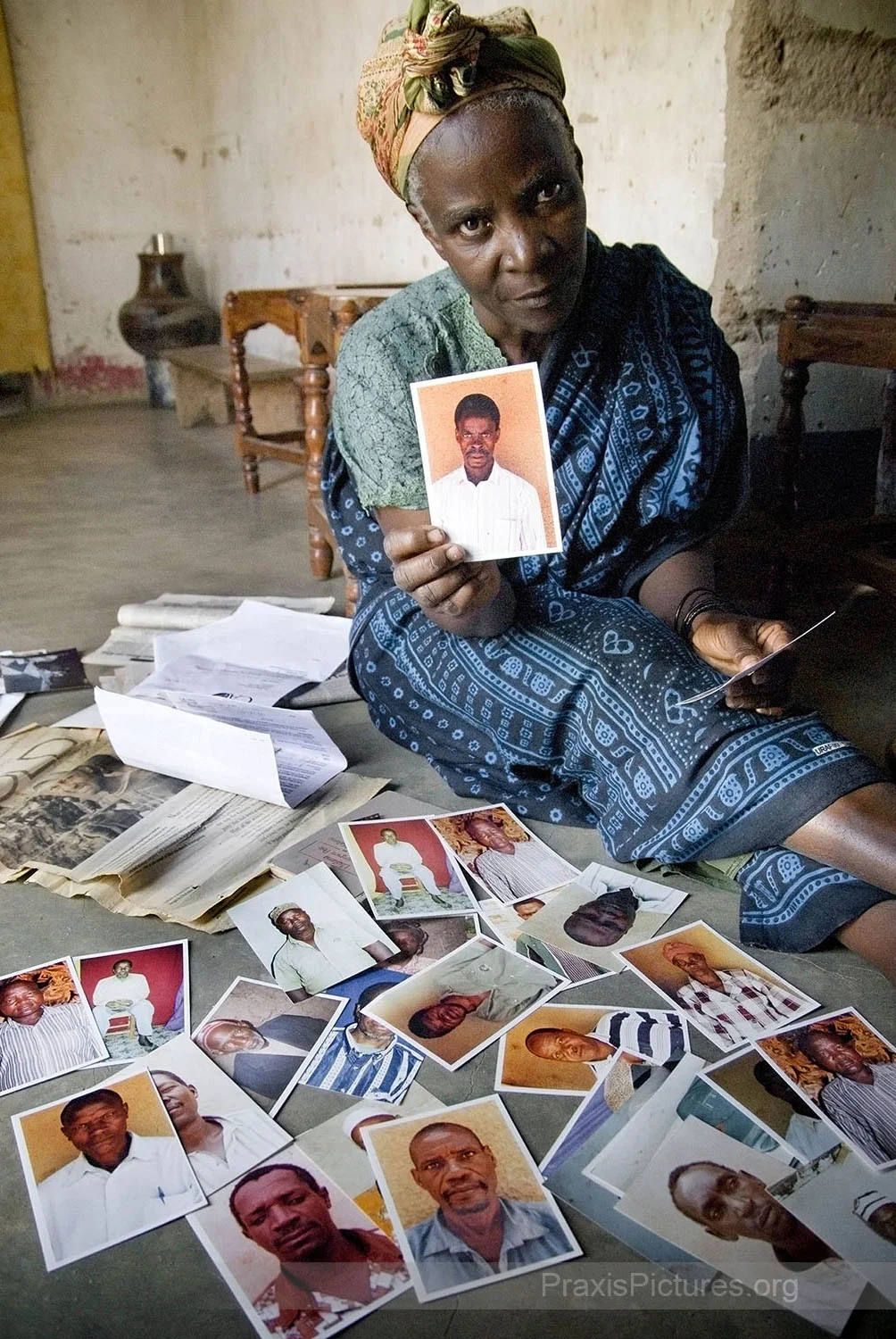 Melania was one of the thousands of people who were displaced to make way for the Bulyanhulu Gold Mine in Tanzania. Melania’s two eldest sons, Jonathan and Ernest were among the fifty-two miners who were allegedly buried alive during the evictions. The family owned the pit that they were working in at the time, so Melania lost her livelihood as well as her two children. In response to the companies’ and the government’s denials, Melania has been collecting these photos of people who claim to have witnessed the killings or lost loved ones during the evictions. “…This one was there when it happened … this one lost her son … this one went back afterwards to try and dig out his friends … this one lost her home and her grandchildren …”