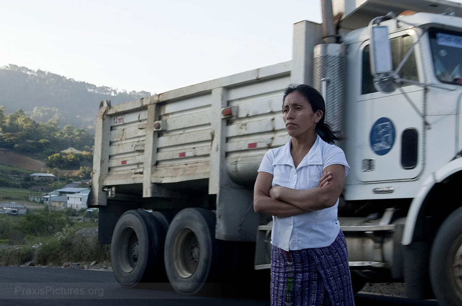 ROSALIA - Rosalia stands on what used to be part of her farm until the mine expanded a single lane dirt road to accommodate large mining trucks. Rosalia’s family says it was never consulted or compensated for the loss of their land. When the company first arrived in the area, they carried out a series of presentations on the benefits of mining. The company claims to have held 74 meetings with people in San Miguel Ixtahuacán and Sipakapa. Those who attended the meetings were were asked to sign a list in exchange for a free lunch. Community members say that these lists were then used by Goldcorp to prove to the Government and the World Bank that they had consulted the local communities. “There was no dialogue and no consultation with the communities about the company coming here,” they say, “the public was not consulted. That is why we are very upset, because these people have money, they are millionaires, they can do what they want. They don’t care about our lives. We did what we could, but it didn’t make any difference. The old Mayor and Judge sided with the company for the money. So the people couldn’t defend their rights.”