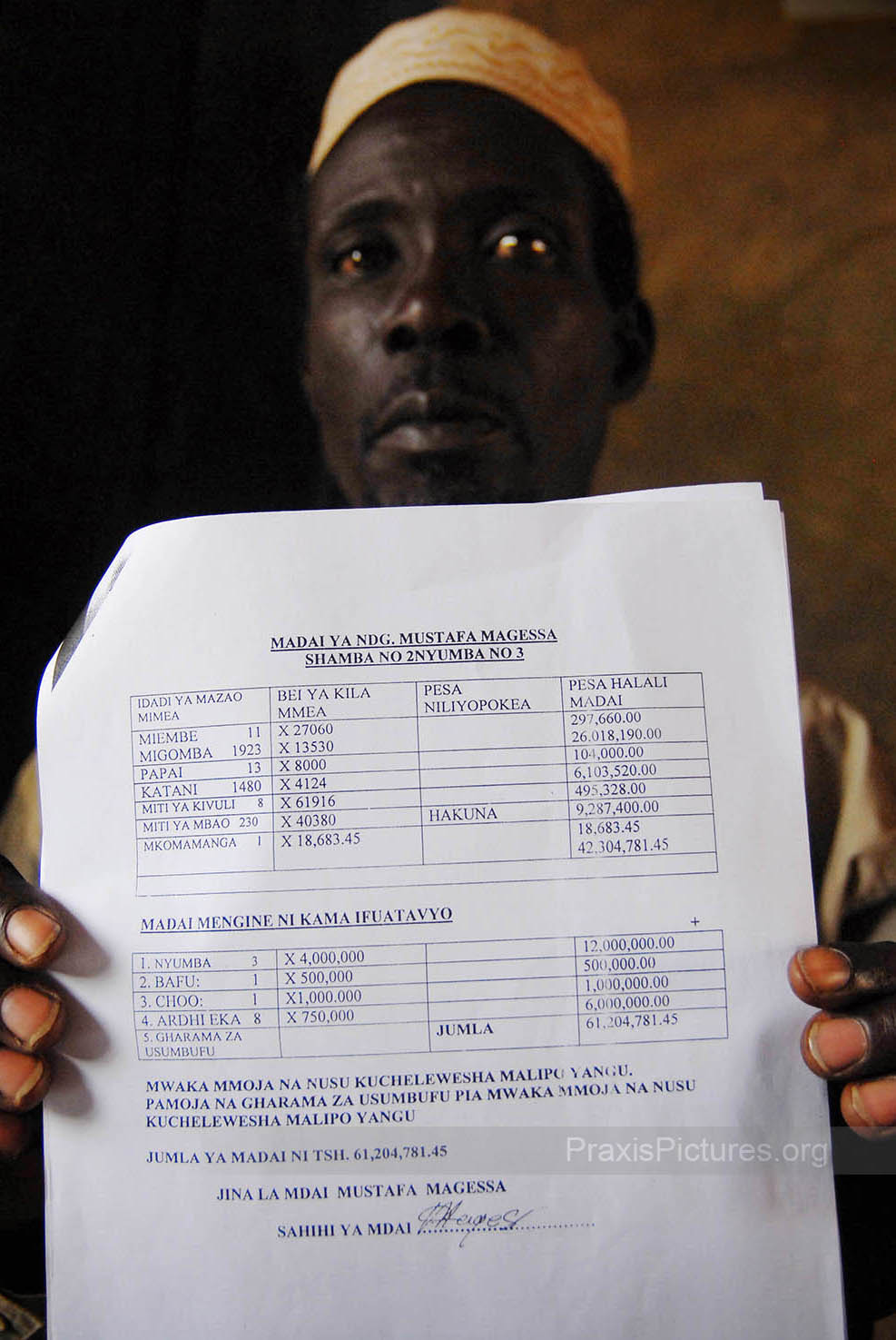 MUSTAFA - The government’s Prevention of Corruption Bureau is investigating a corruption scandal involving the compensation for some 900 people who were displaced to make way for AngloGold Ashanti’s Geita Gold Mine in Geita. Mustafa is one of the complainants; here he is showing documents that state that he was promised over 60million shillings (55,000CAD) in compensation which he has never received. AngloGold admits that 875 people have not received the compensation promised to them, but they claim to have given government officials the money needed to make the payments in 1999 and blame these officials “in their lust for money” for the disappearance of the funds.