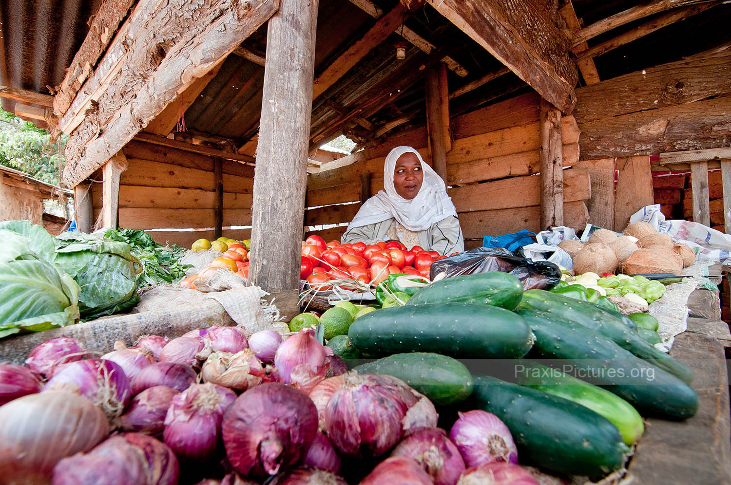 FARAHA - Faraha sells vegetables in the market in Lushoto thanks to a small start-up loan from her local VICOBA group.