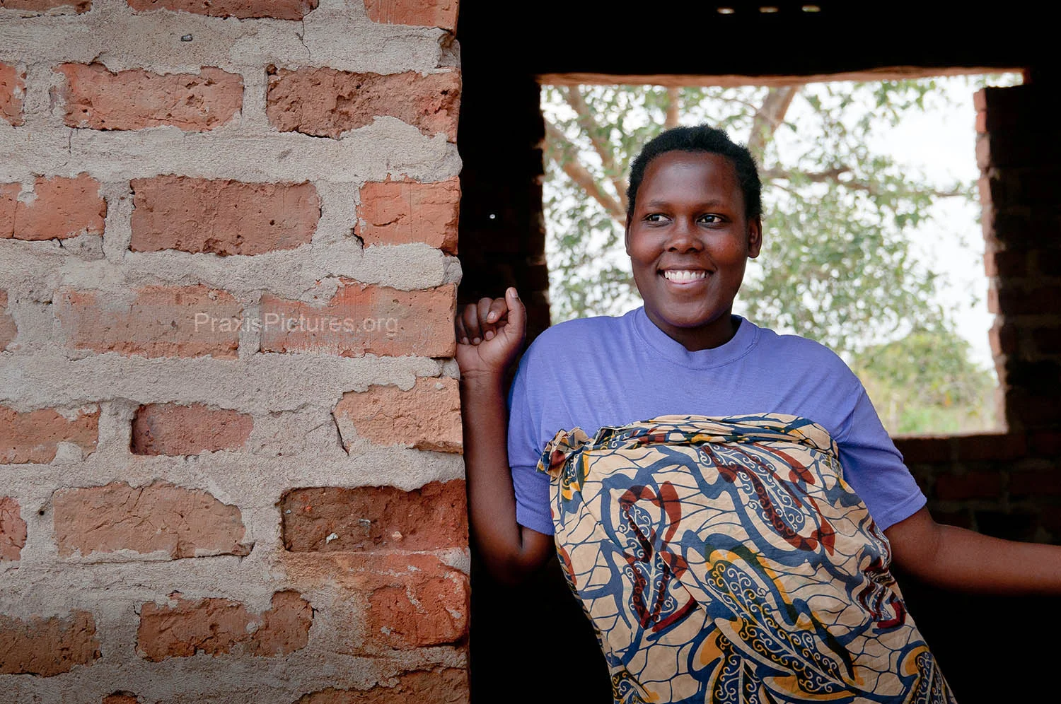 CHRISTINA - Christina sells rice in the Geita market. Her mother was a member of VICOBA and passed her shares on to Christina when she moved away. Christina has big dream for herself and her family, right now she is only a few months away from completing the construction of their new home.