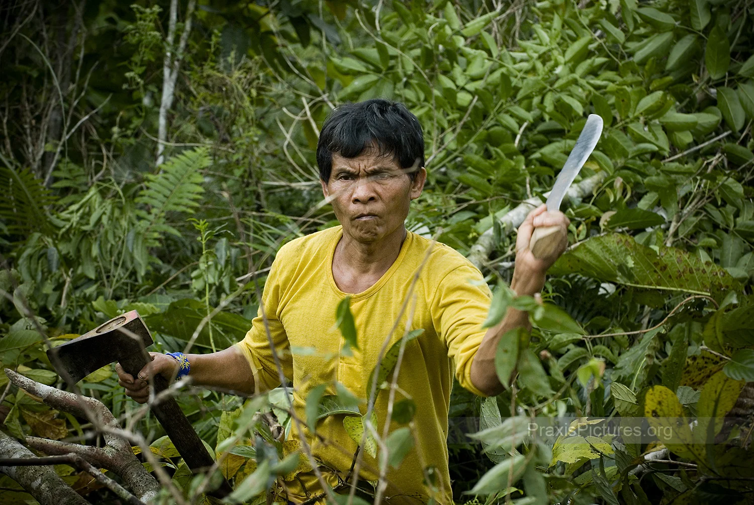 ALANGAN - Ramon , of the Alangan tribe in the village of Kisluyan, in Mindoro. Kisluyan is one of 26 indigenous villages that face the threat of displacement if Crew Minerals (now Intex Resources) opens up a nickel mine on their ancestral land. Although many of the indigenous peoples in the neighboring villages are opposed to the mine, it has proven difficult to organize the groups to show their unified opposition and stand up for their rights. Traditionally the Alangan have been averse to confrontation. Crew has taken advantage by forming their own group to pose as representatives of the affected indigenous communities to sign documents consenting to the mining operations.
