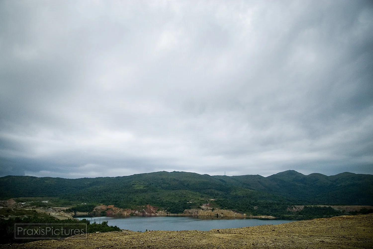 Since Placer Dome left the Philippines the abandoned Sand Antonio Pit has gradually filled with rainwater. The San Antonio Pit now contains millions of tons of water, which has mixed with mine waste and other toxic chemicals, being held back by fail…