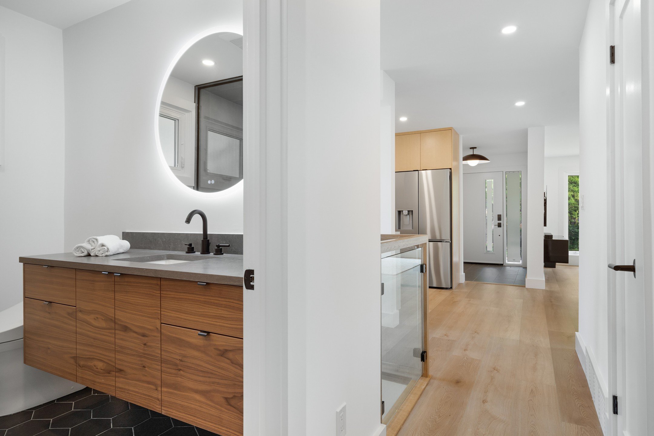 This modern bungalow redesign embodies the essence of Scandic simplicity, embracing clean lines and understated elegance. Light wood floors and minimalistic cabinetry blend seamlessly with neutral tones, creating a serene and contemporary atmosphere,