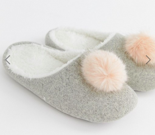 ASOS: Pom Slipper How fun are these?! These cozy and cute slippers are sure to remind your loved one to have a little fun and pep! Everybody needs a comfy slipper and why not go for something with a little more zest!