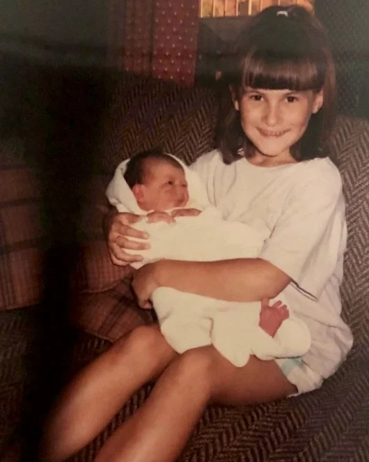 My older sister and I at ages 7 and fresh out of the womb!