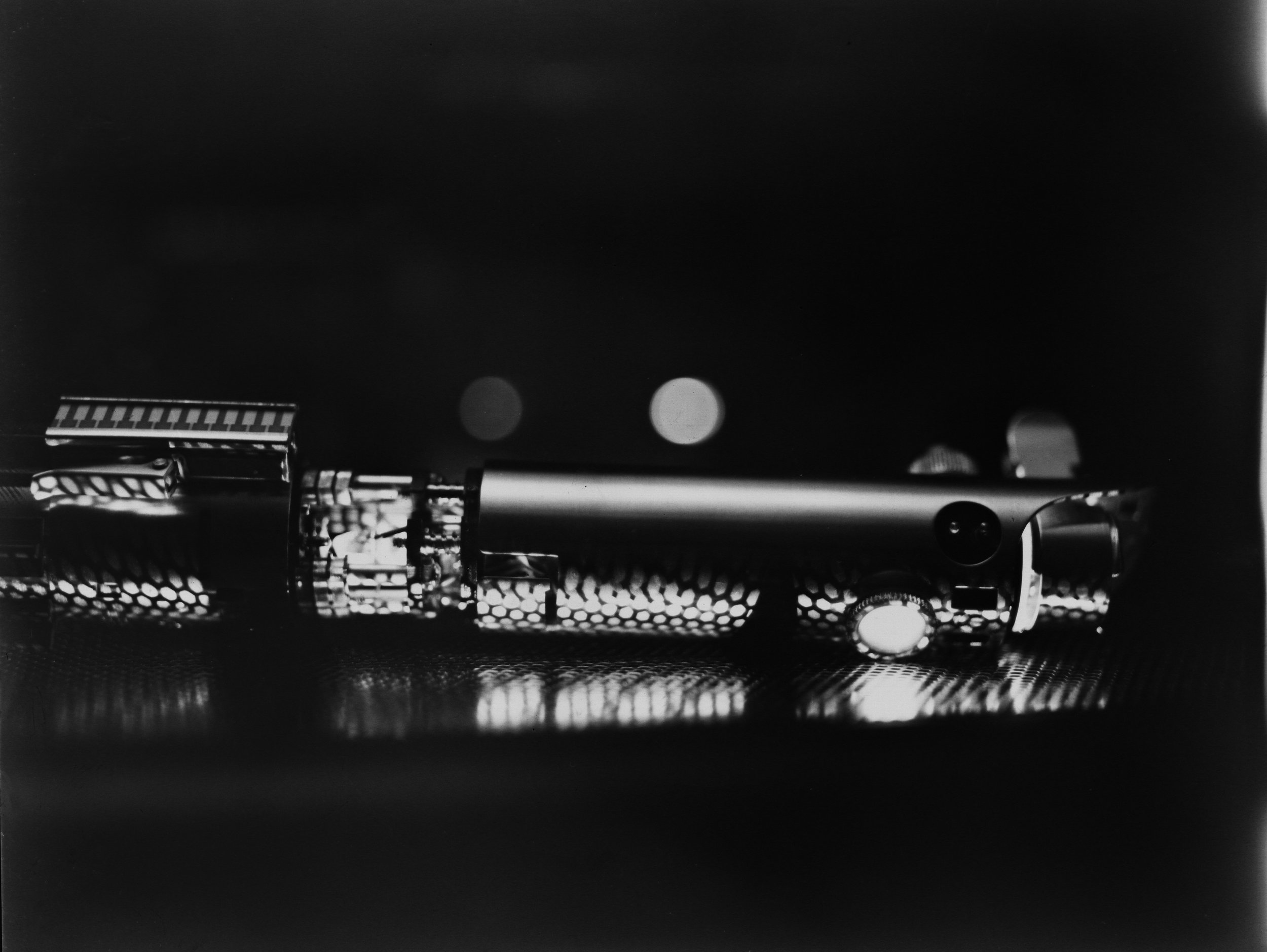 My first self developed photograph. Shot with the Graflex camera that the lightsaber in this picture (my first version) used to be the flash handle for. Graflex-seption.