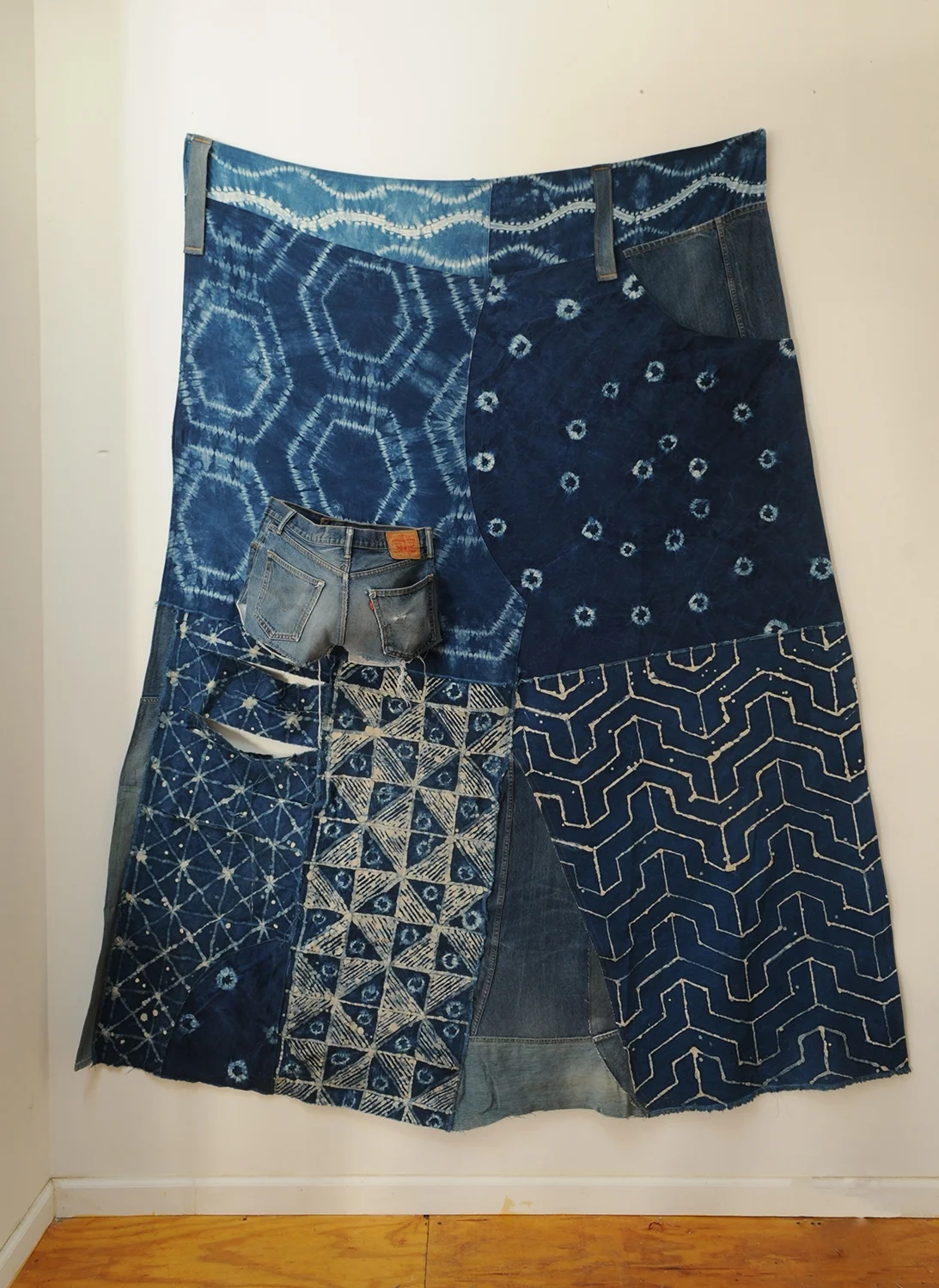 Big Jean Skirt, or The Rich Soul receives blue crystals sprinkled down upon her head.