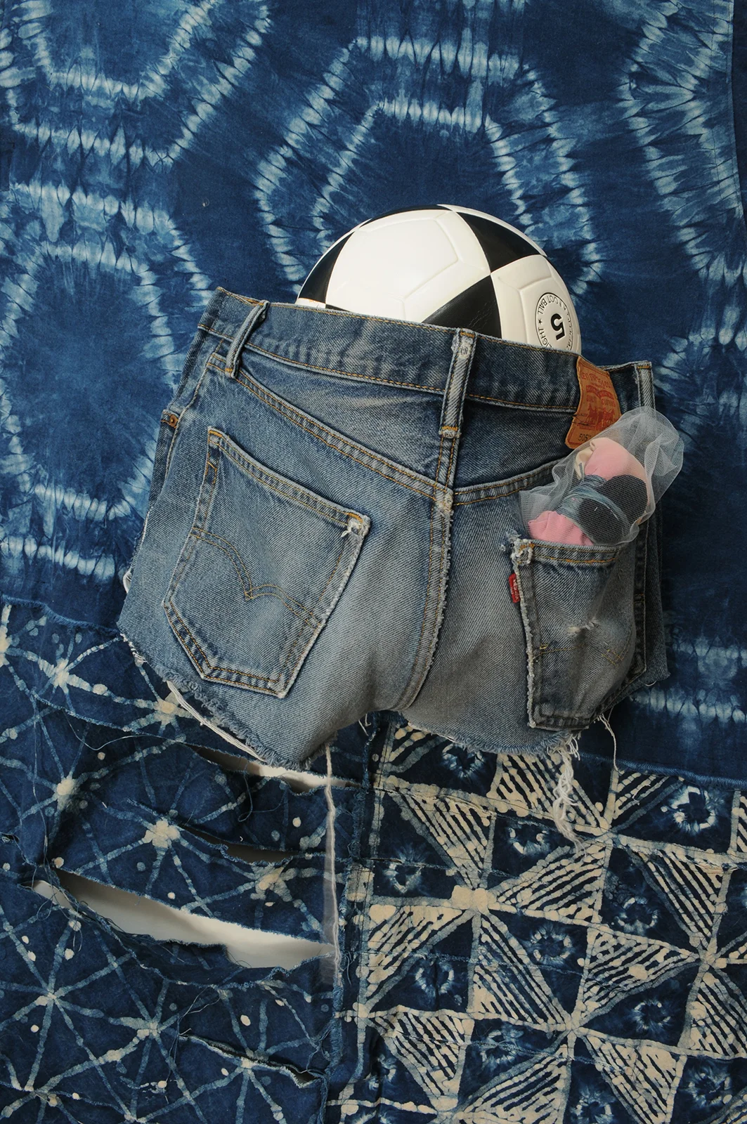 Big Jean Skirt, or The Rich Soul receives blue crystals sprinkled down upon her head.