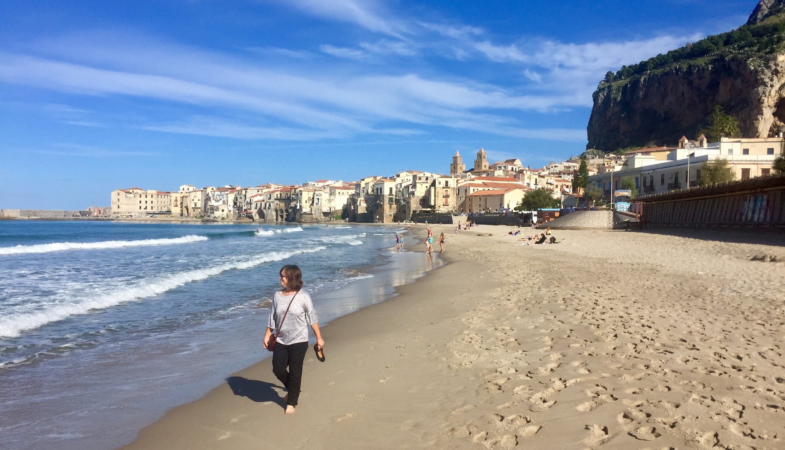 Walking the beach at Cefalu, Sicily