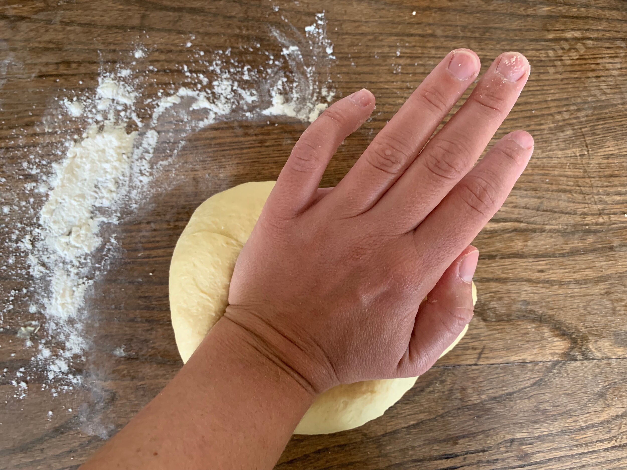 Kneading the dough for tarte flambée 