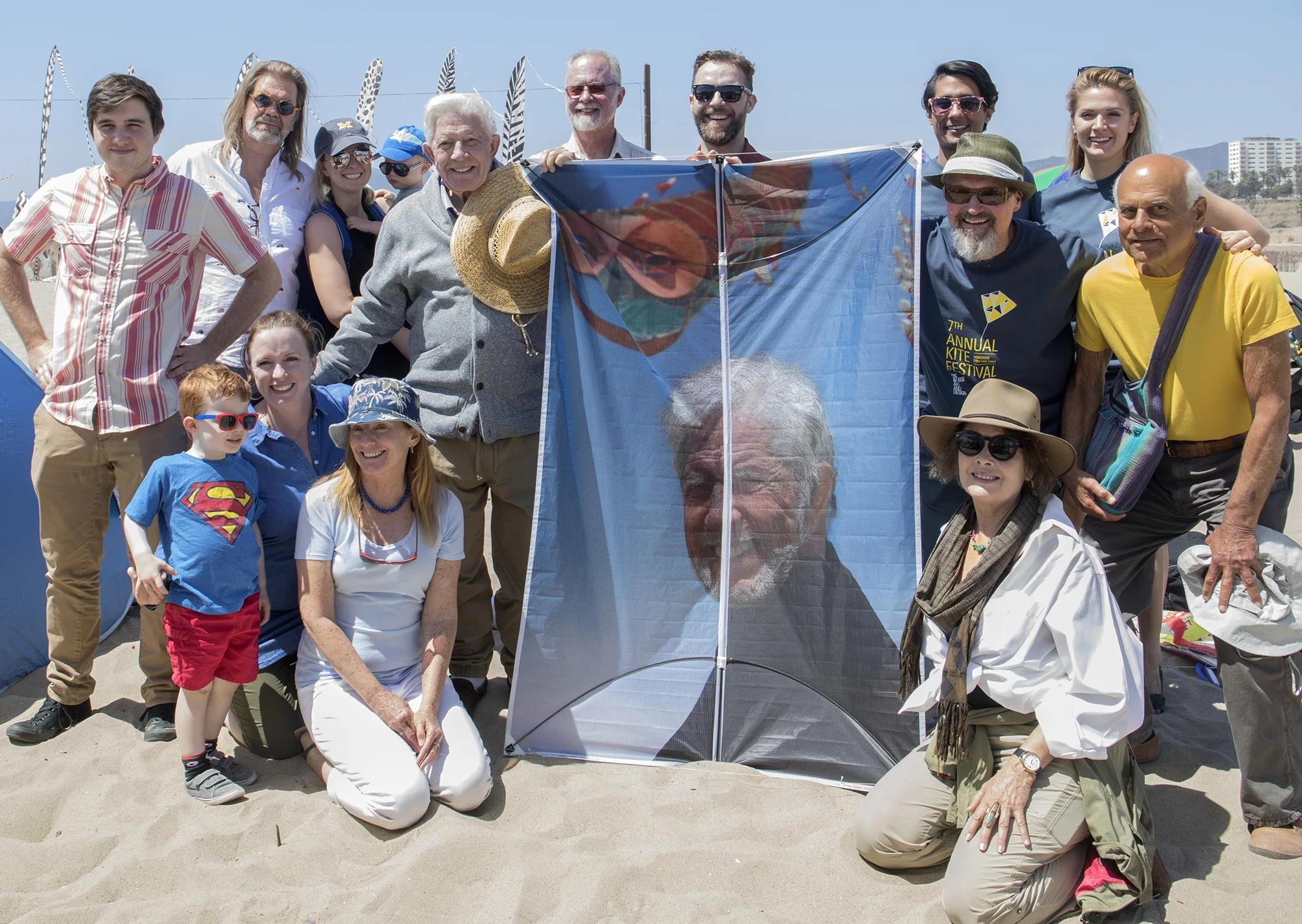 Tom Van Sant with family/ friends and custom portrait kite with Richard Shelton, Director of Creative Action Program at Otis College (middle row, second from right)