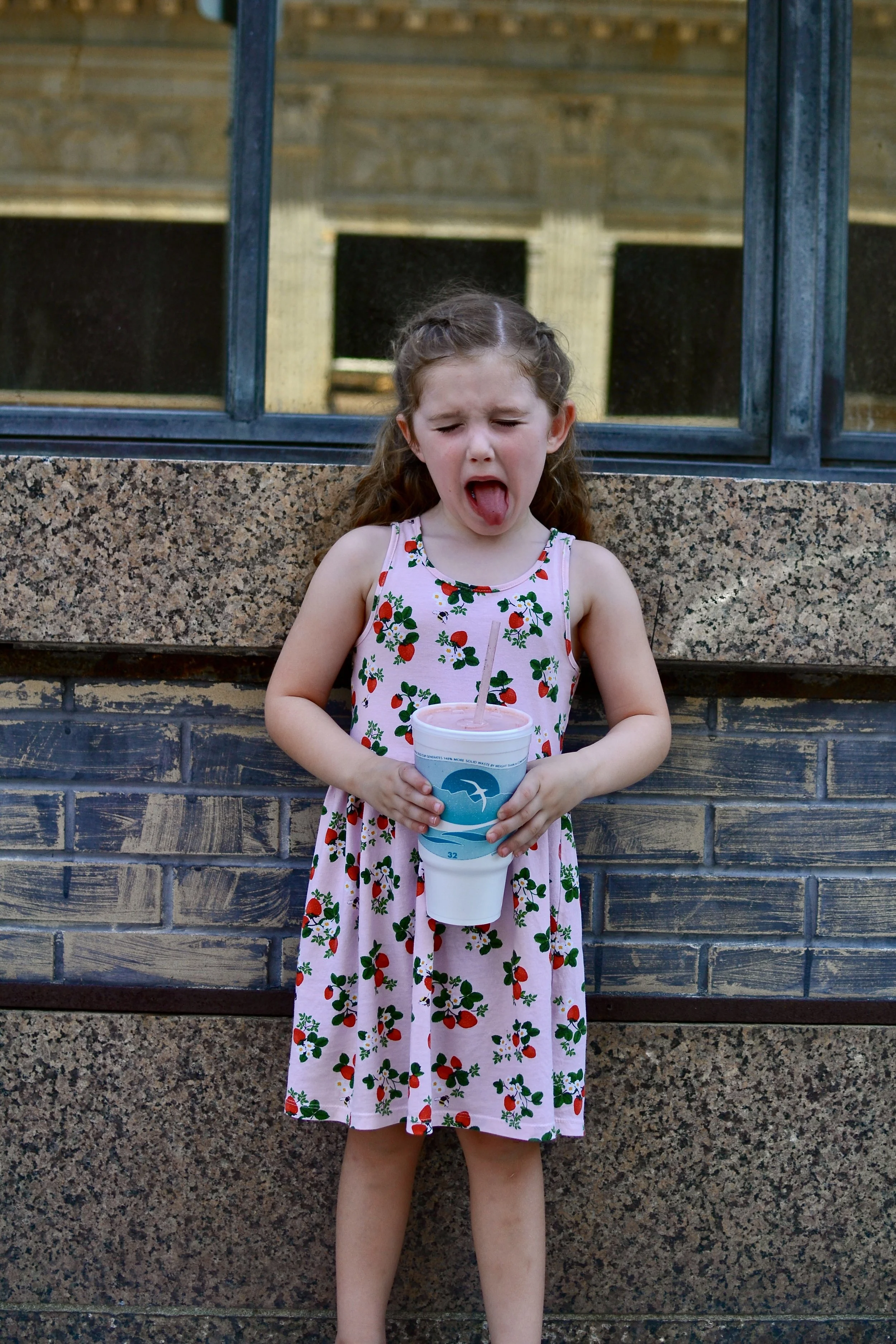 Pippa hogging the giant strawberry, banana, kiwi smoothie