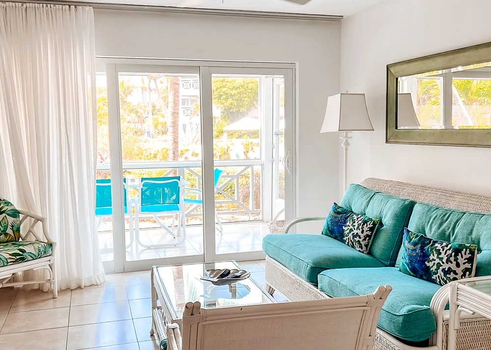 hotel living room area with couch and coffee table