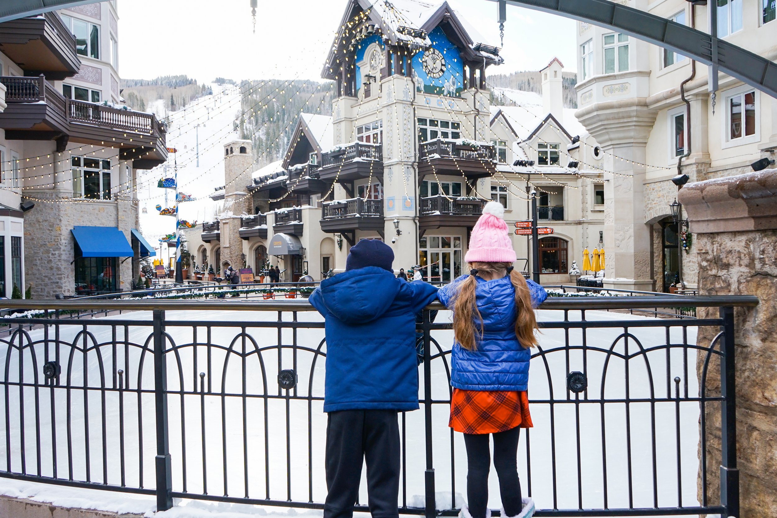 kids looking at ice skating rink vail co