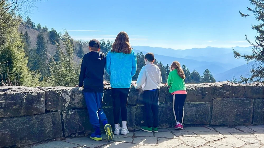 4 kids enjoying the view of mountains at Great Smoky Mountains National park