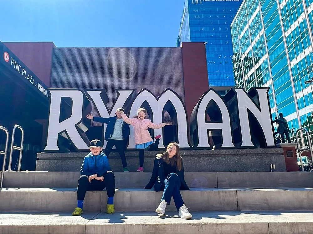 Kids Posing in front of Ryman Auditorium Sign in Nashville