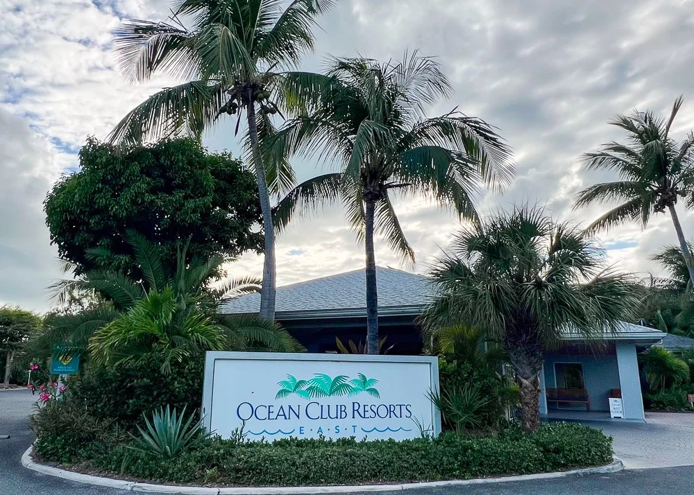 Ocean Club Resorts sign with palm trees
