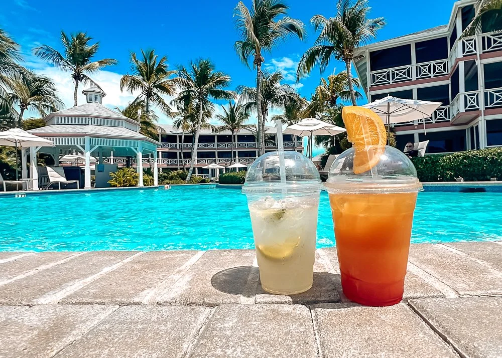 cocktails in front of a pool