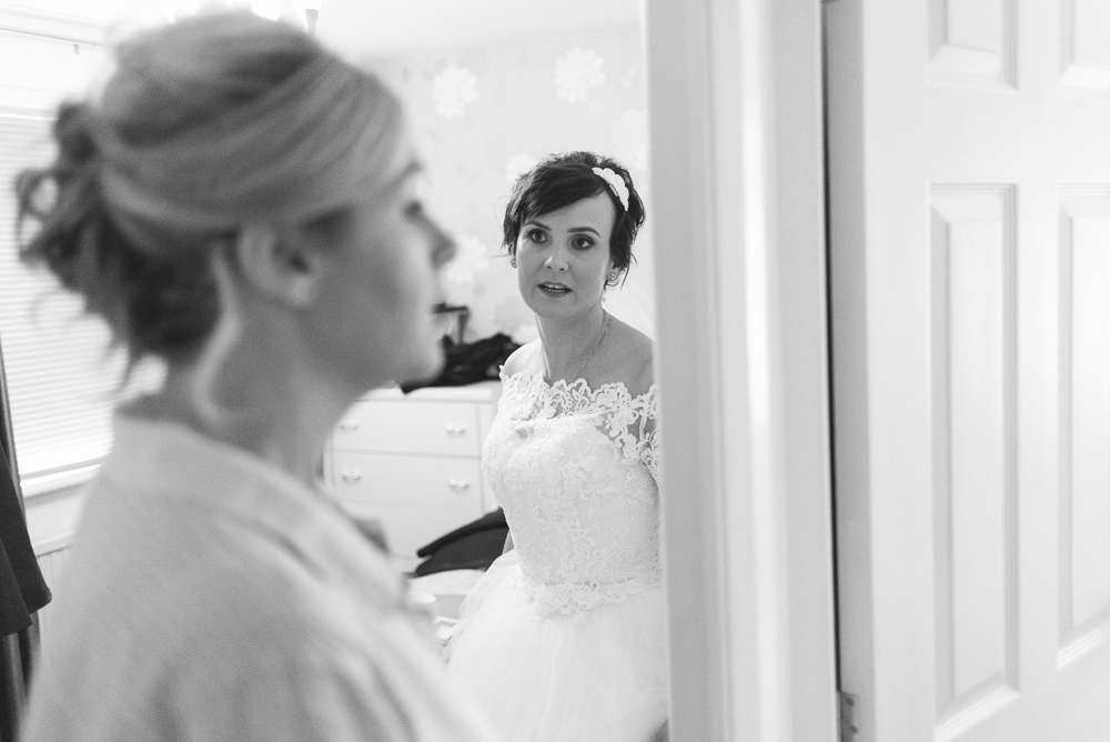 Bride looking at bridesmaid in Salford