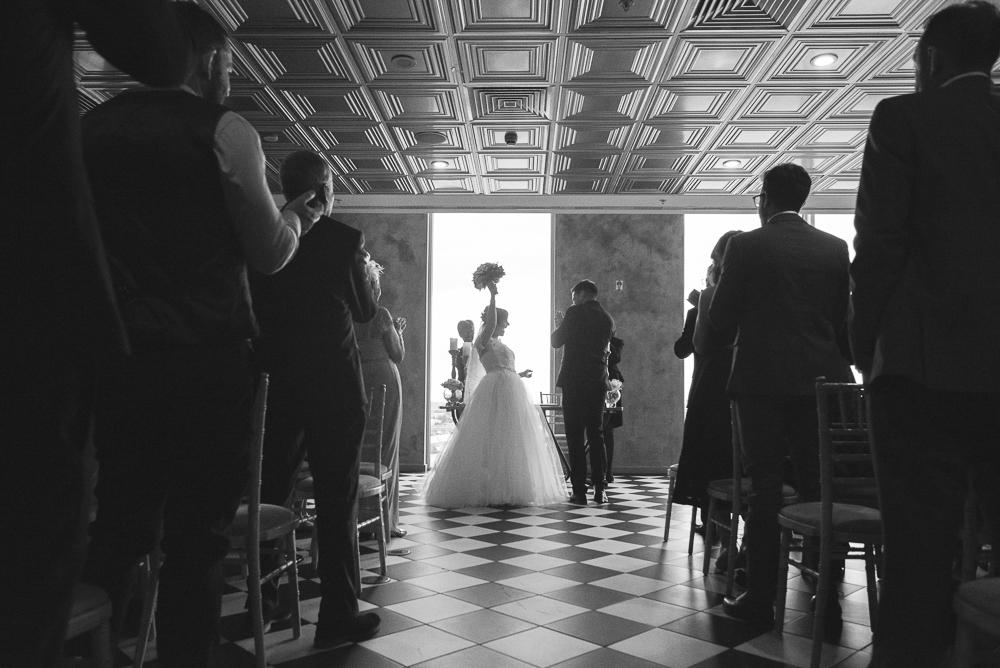 silhouette of bride and guests in Media City Salford