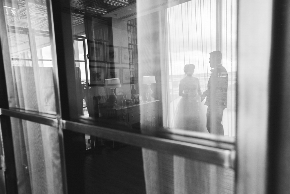 Reflection of bride and groom in Media City