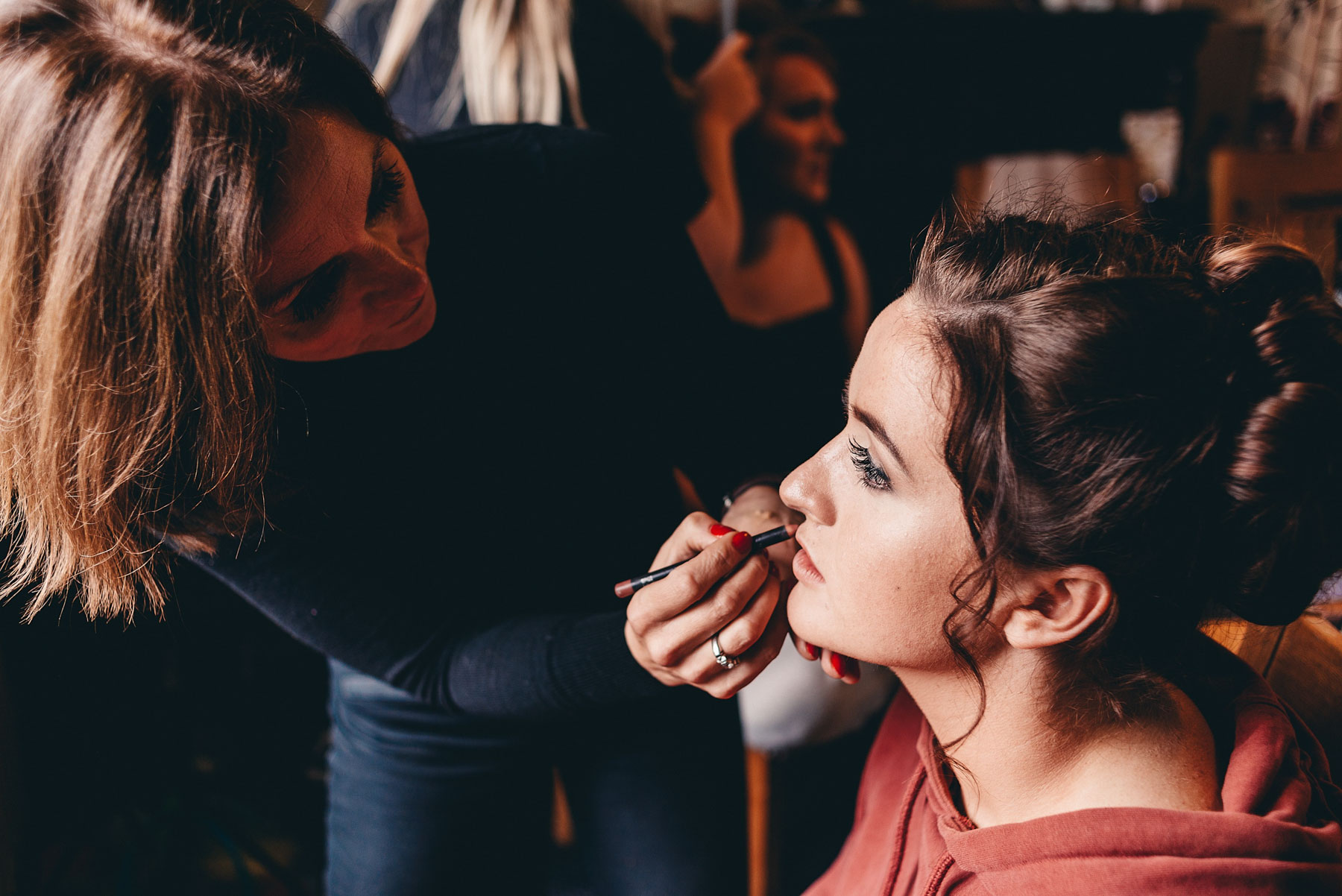 Bridesmaid getting her makeup applied