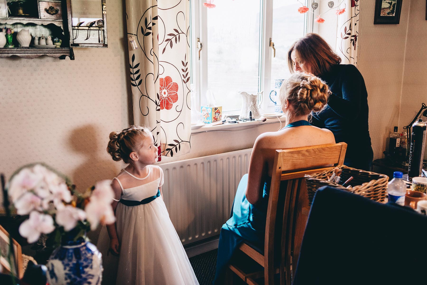 Young bridesmaid watching makeup