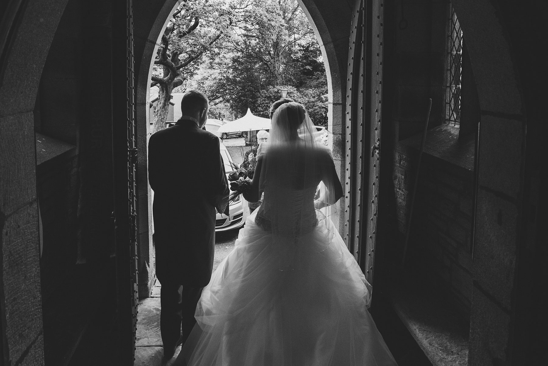Bride and groom leave church after getting married in Saddleworth