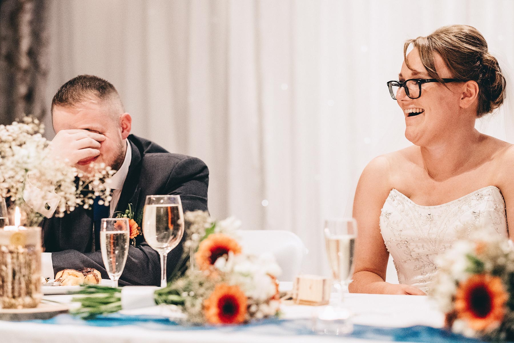 Groom holds his head during speeches
