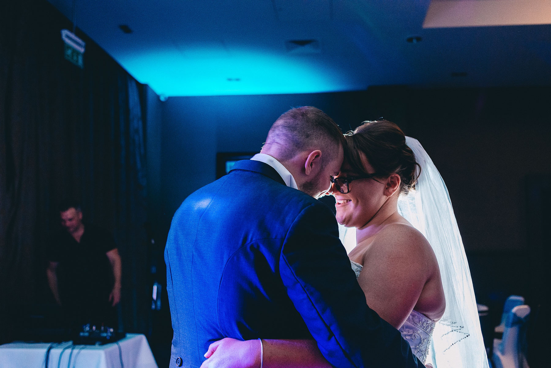 Bride and groom touch heads during first dance