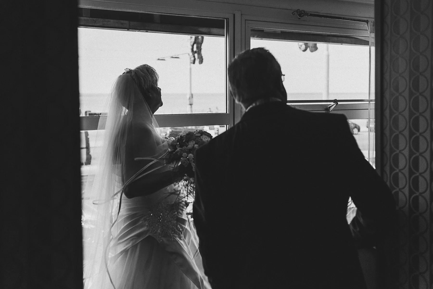 Bride and her father wait to go to the ceremony