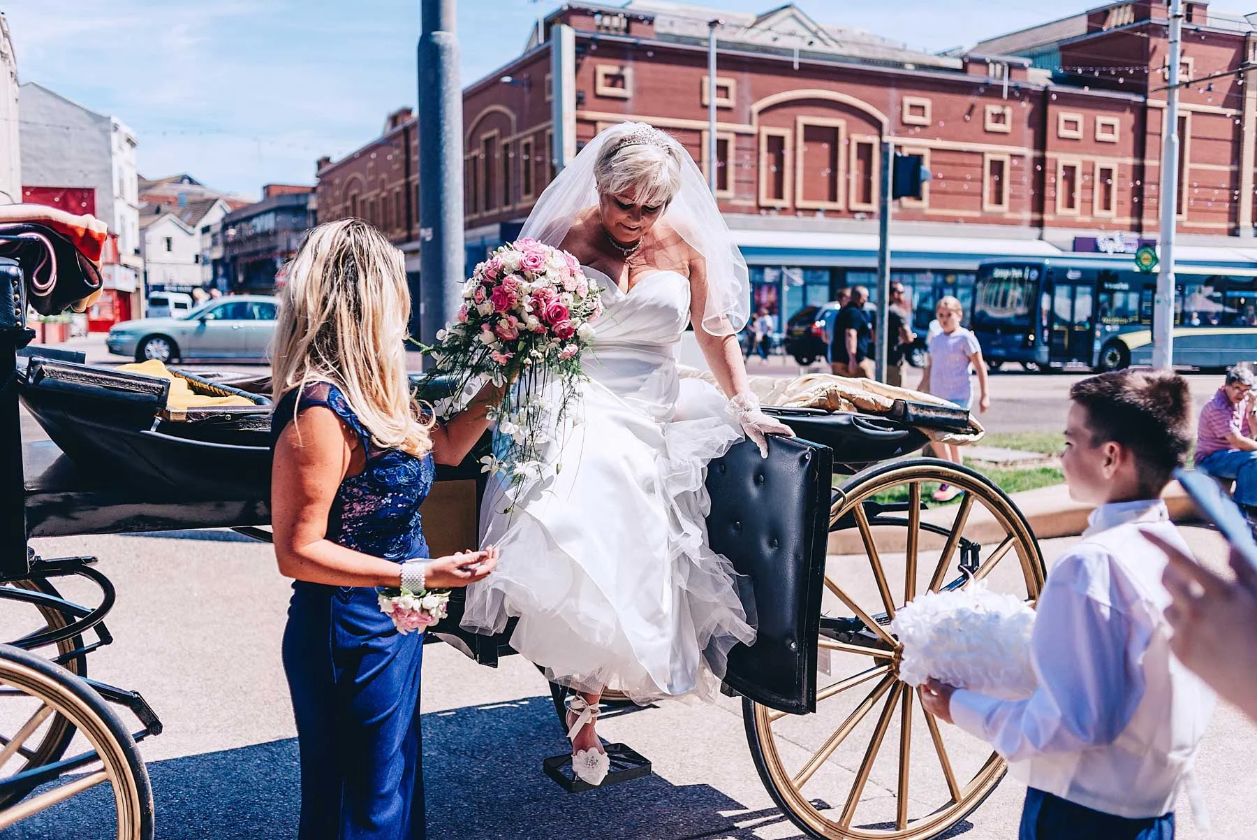 Bride steps down from her horse and cart