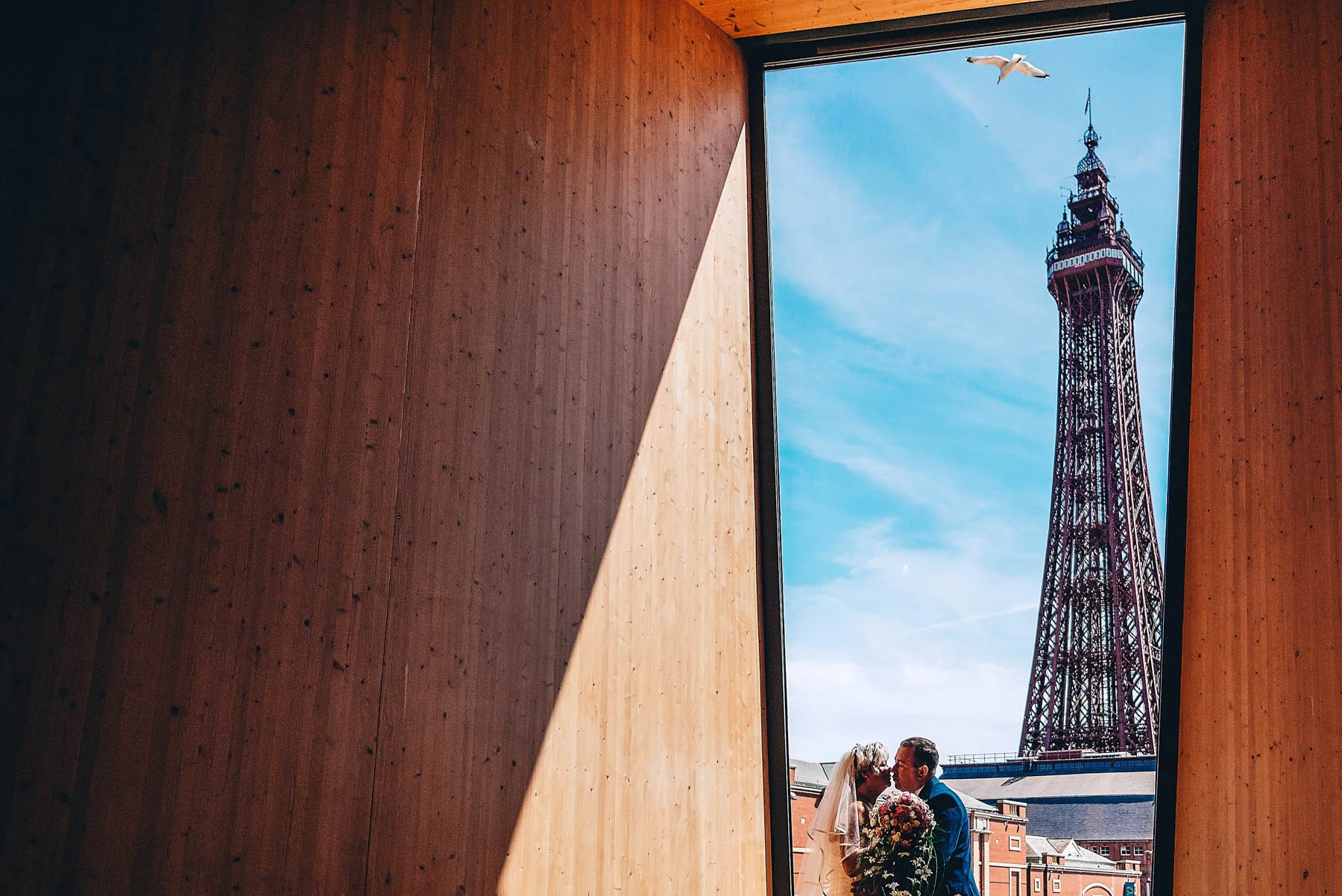 Bride and Groom kiss in front of Blackpool Tower