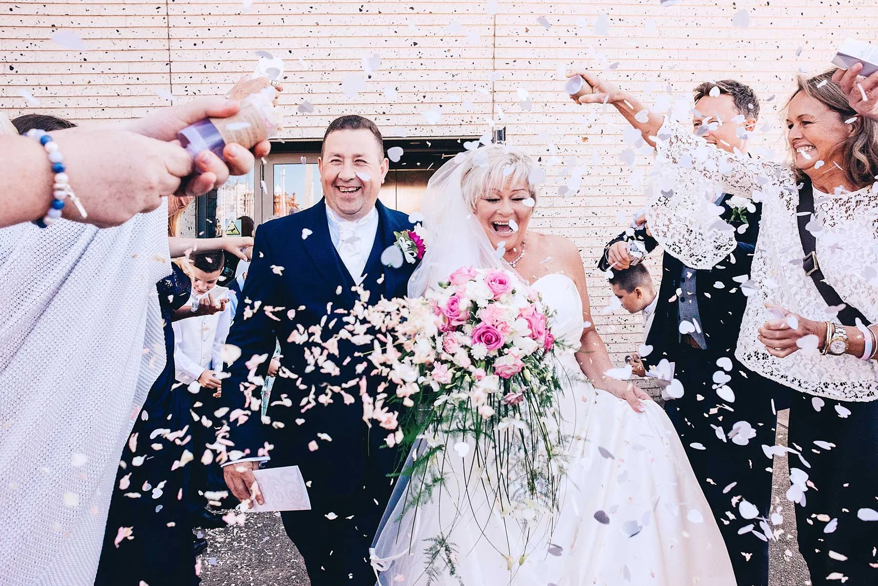 Bride and Groom leave ceremony to confetti