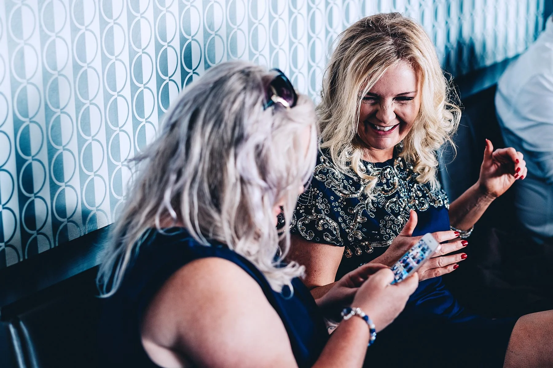 Two ladies laugh