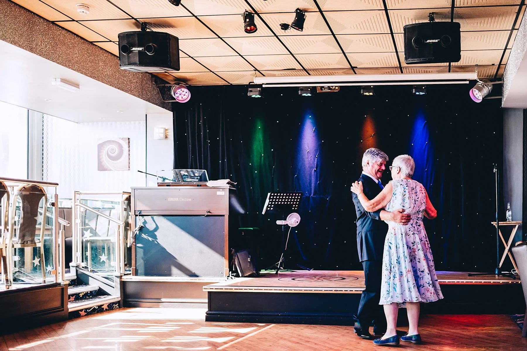 Couple dance on an empty dancefloor