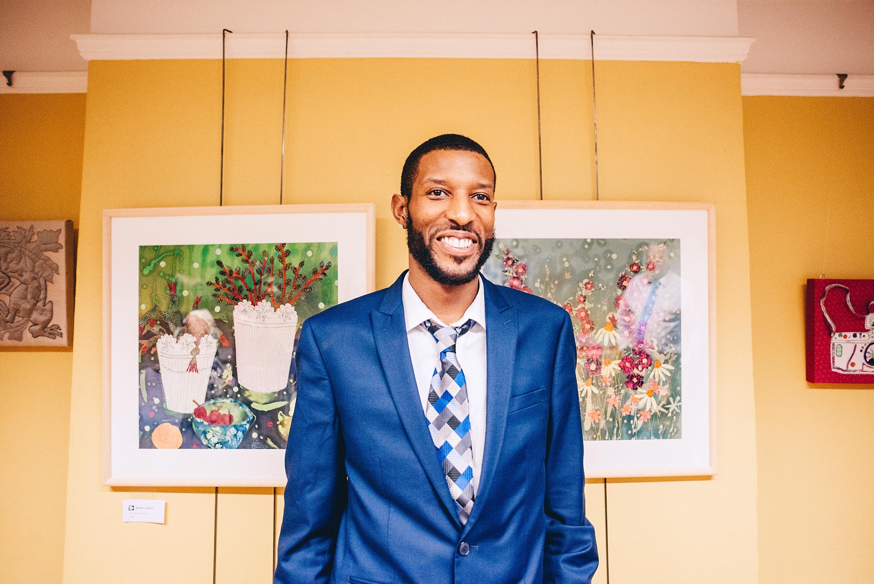 Wedding guest smiles and poses for portrait