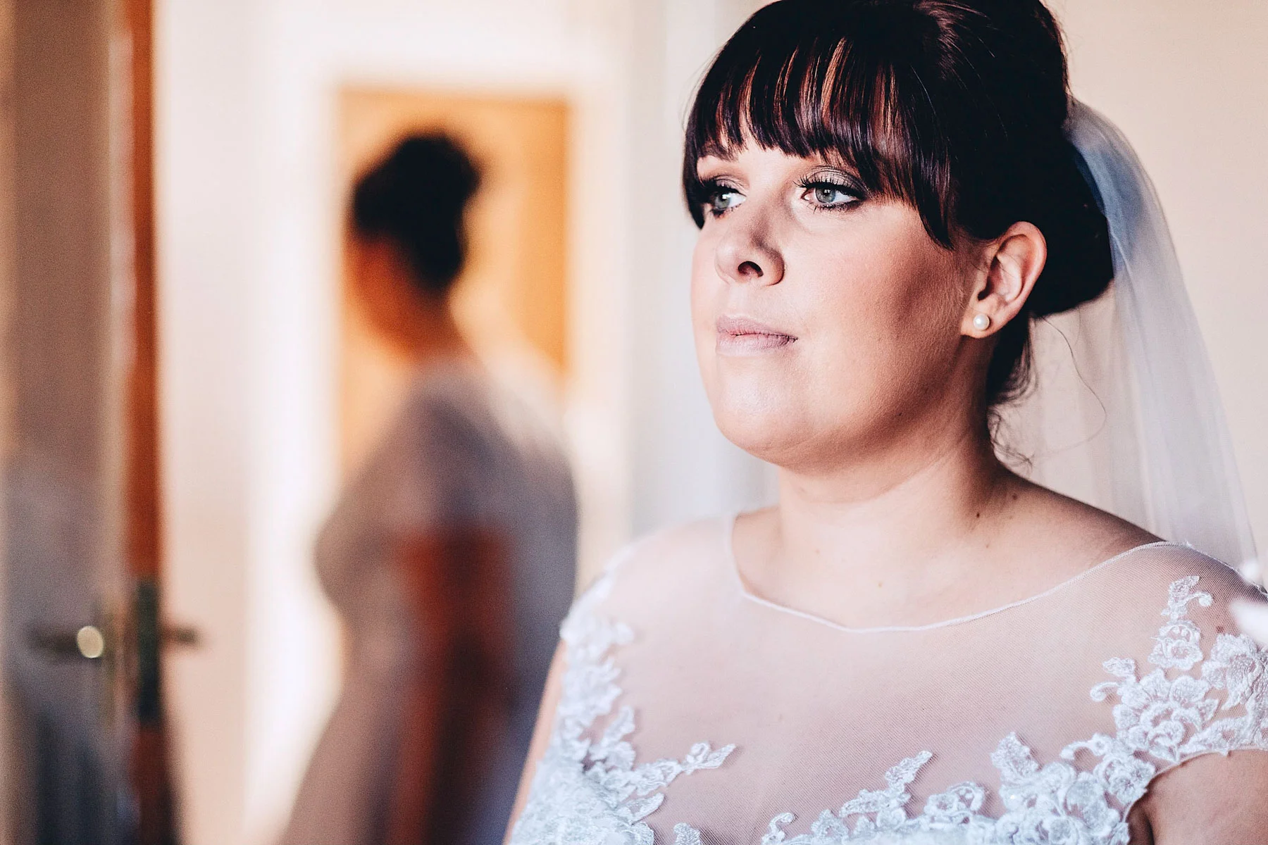 Bride looks on thoughtfully