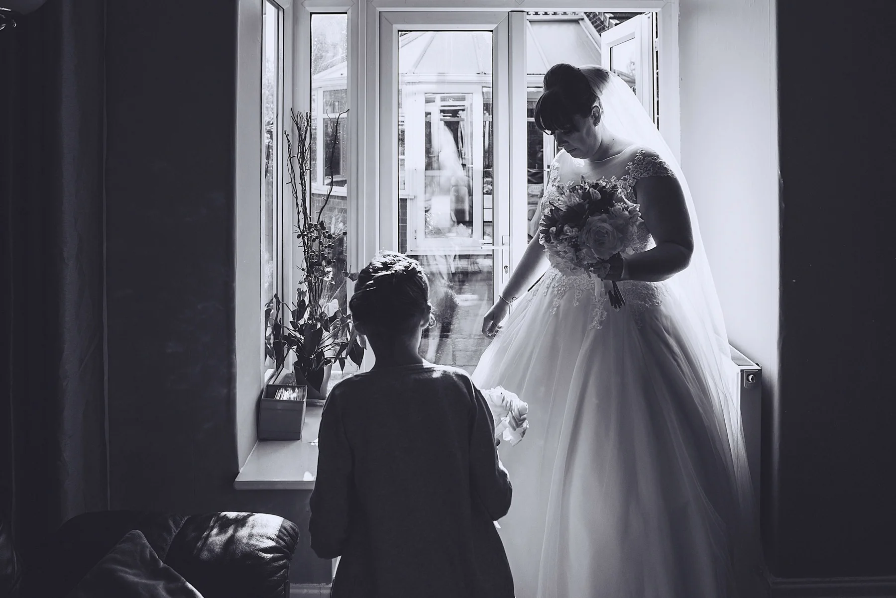 silhouette of daughter and bride