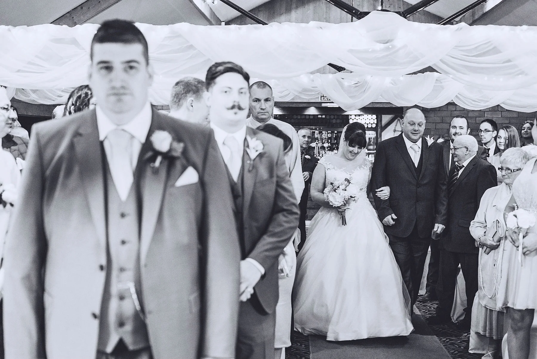 Bride walks up aisle