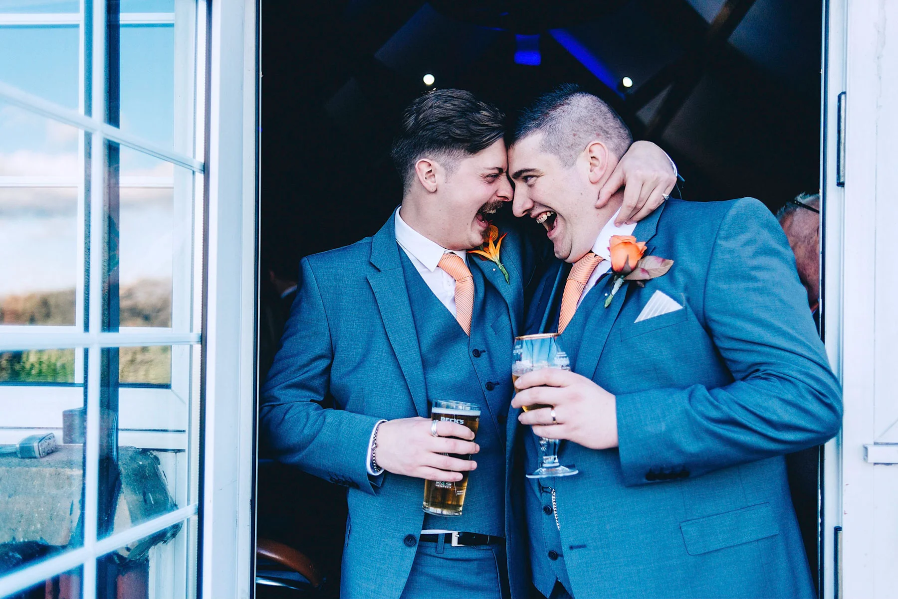 Groom and Best man share joke