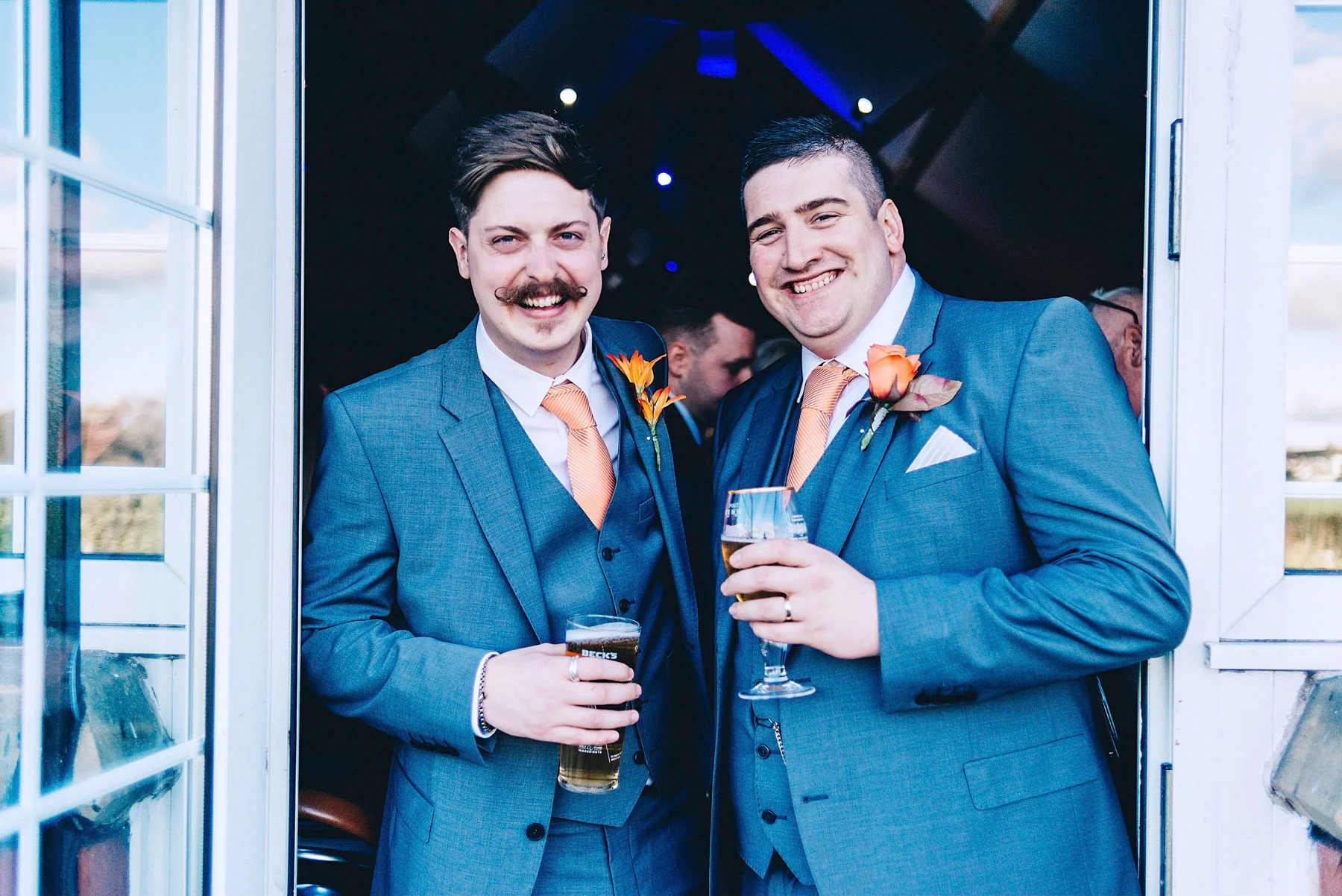 Groom and best man pose for photo