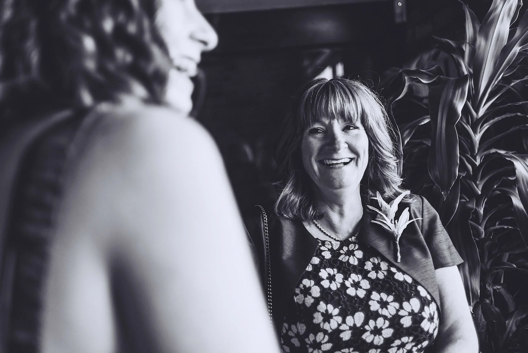 Guest laughs in black and white