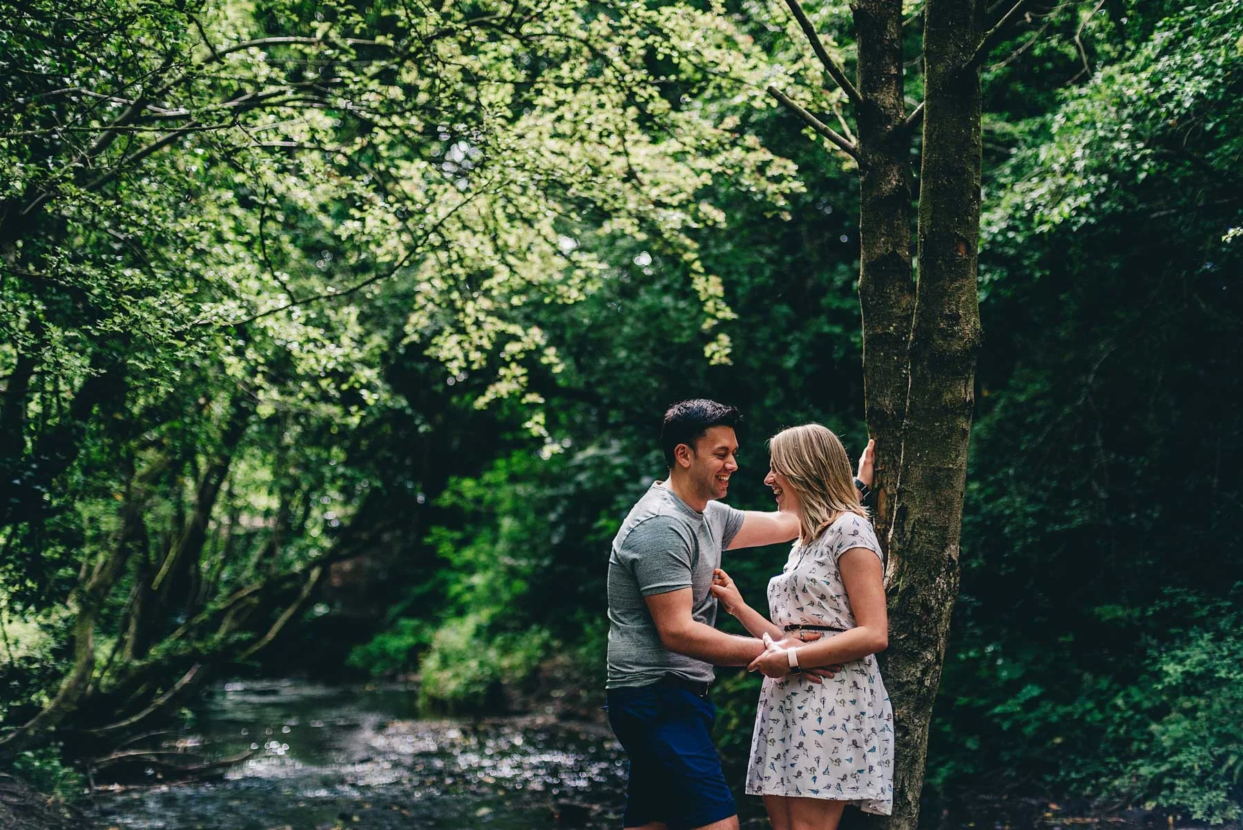 Couple talk under tree